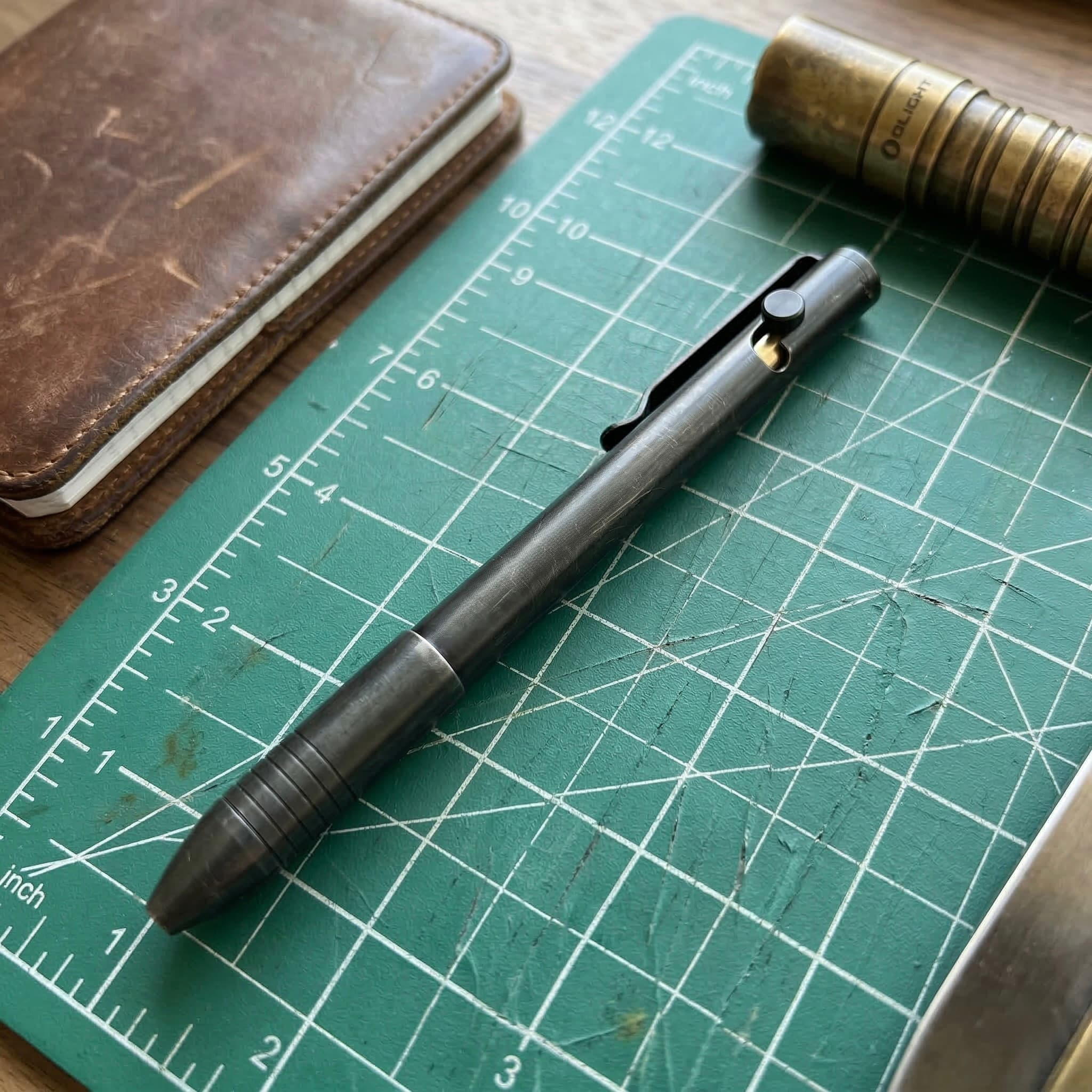 Flashlight and pocket organizer on a table